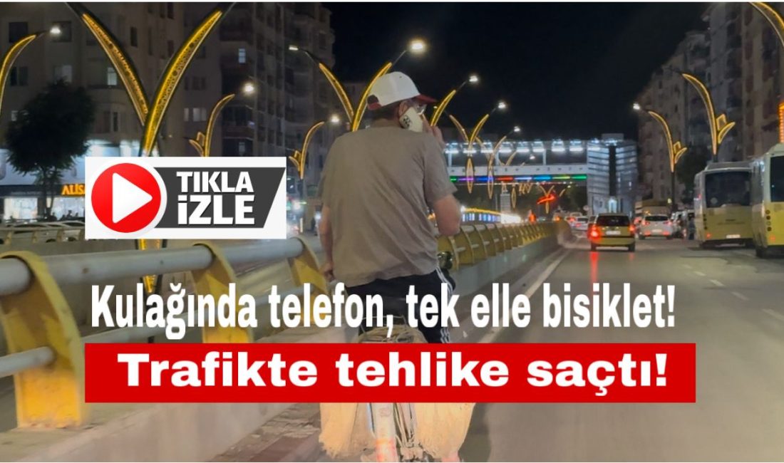 Aksaray’da anayolda telefonla konuşarak bisiklet süren bir kişi, hem kendi