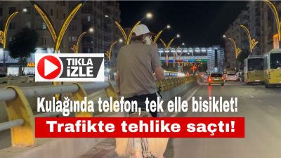 Aksaray’da anayolda telefonla konuşarak bisiklet süren bir kişi, hem kendi