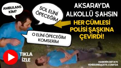 Aksarayda parkta yerde yatan alkollü şahsın polise el öpme ısrarı,