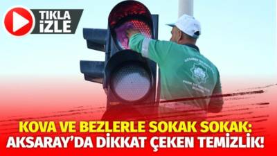 Aksaray’da belediye işçileri kova ve bezlerle sokak lambalarını tek tek